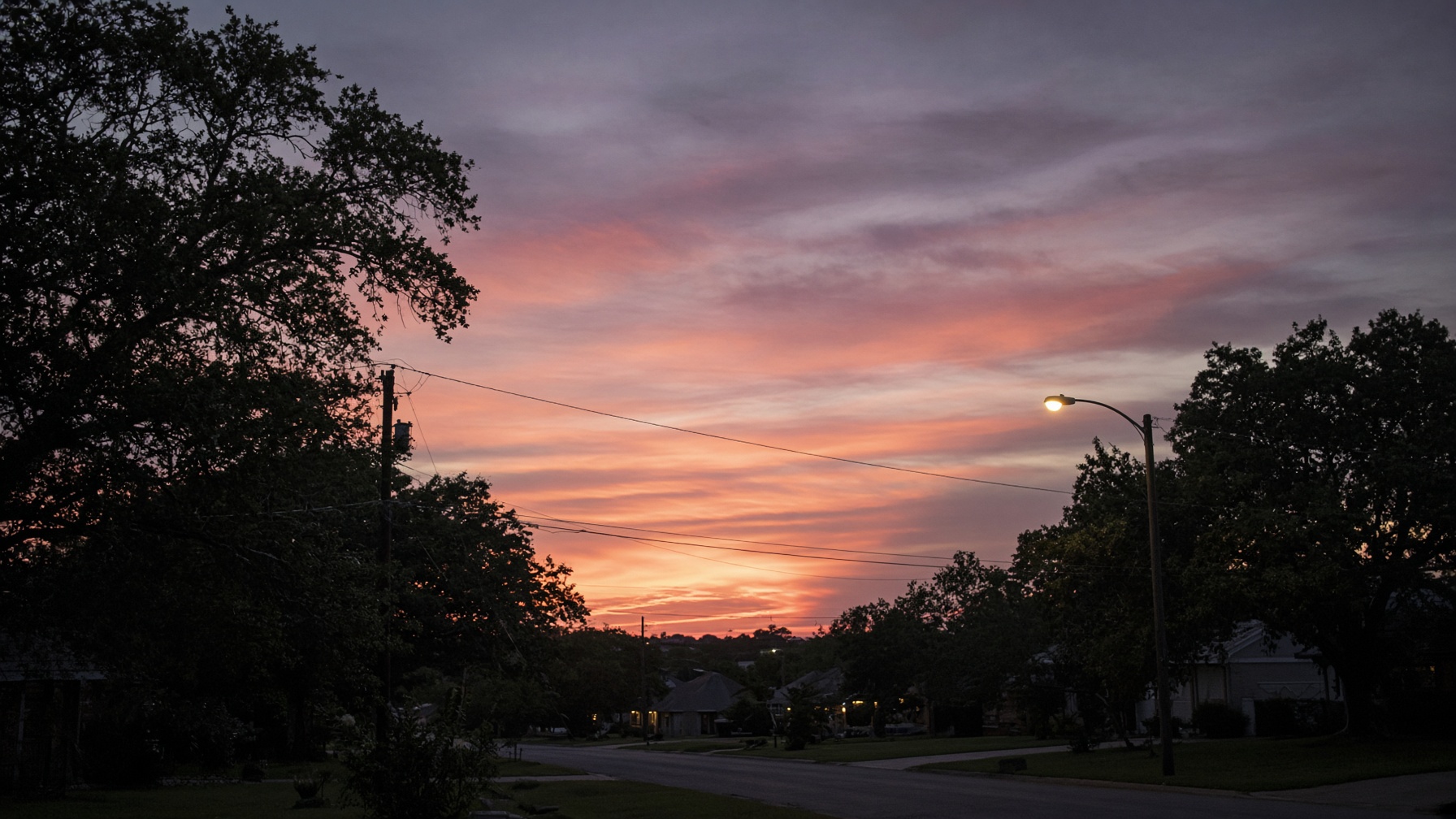 Soft evening light over an ordinary street.